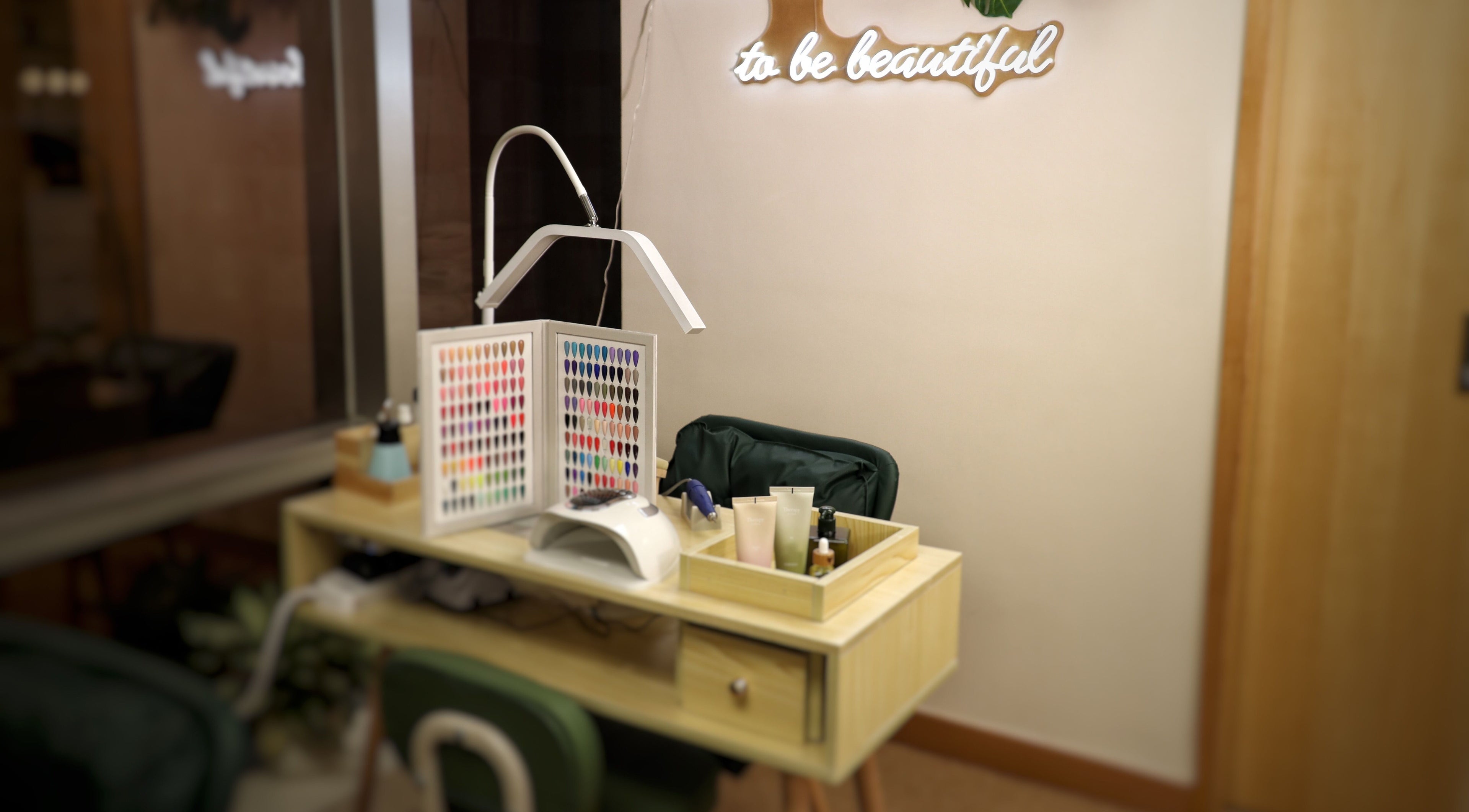 Cozy nail station at The Bar, Hong Kong Island, featuring polishes and decor for a soothing beauty experience.