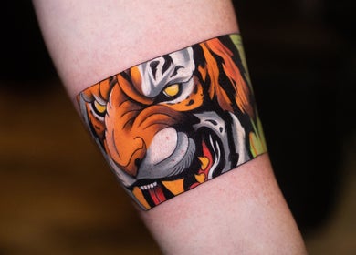 A vivid tiger tattoo on an arm at Wobee Tattoo, Cork, County Cork, IE.