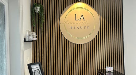 Elegant reception at Laura Anne Beauty, Douglas, with branded signage and modern decor.