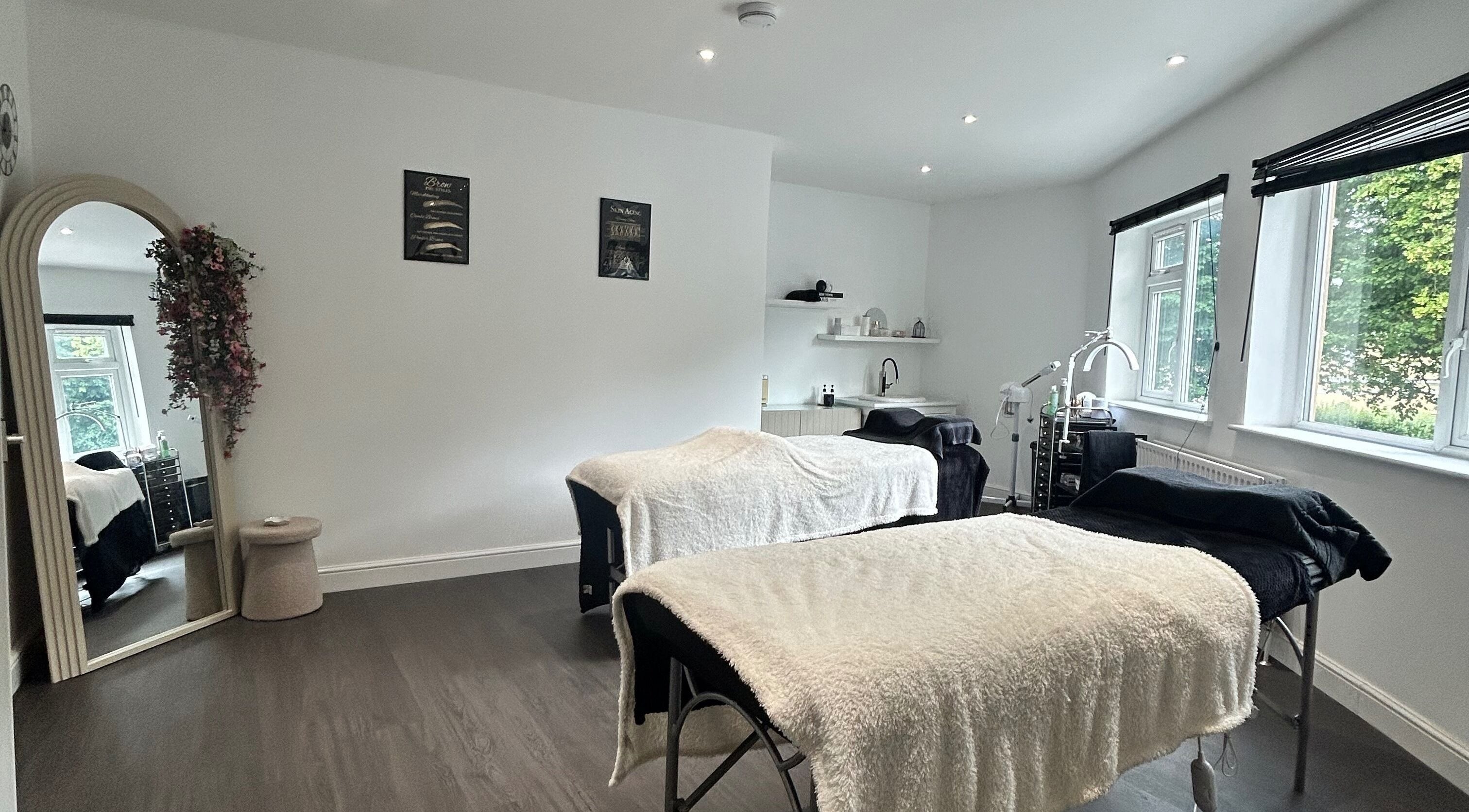Tranquil treatment room at Laura Anne Beauty in Douglas, Douglas, IM, featuring cozy massage beds and natural lighting.