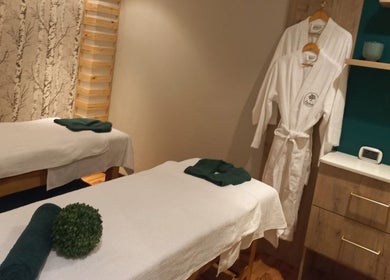 Serene massage room at Orchard Day Spa, Durban, Kwazulu-natal, ZA, featuring dual treatment tables.