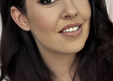 Smiling client at Smak Beauty Clinic Rustenburg, Rustenburg, North West, ZA showing a polished makeup look.