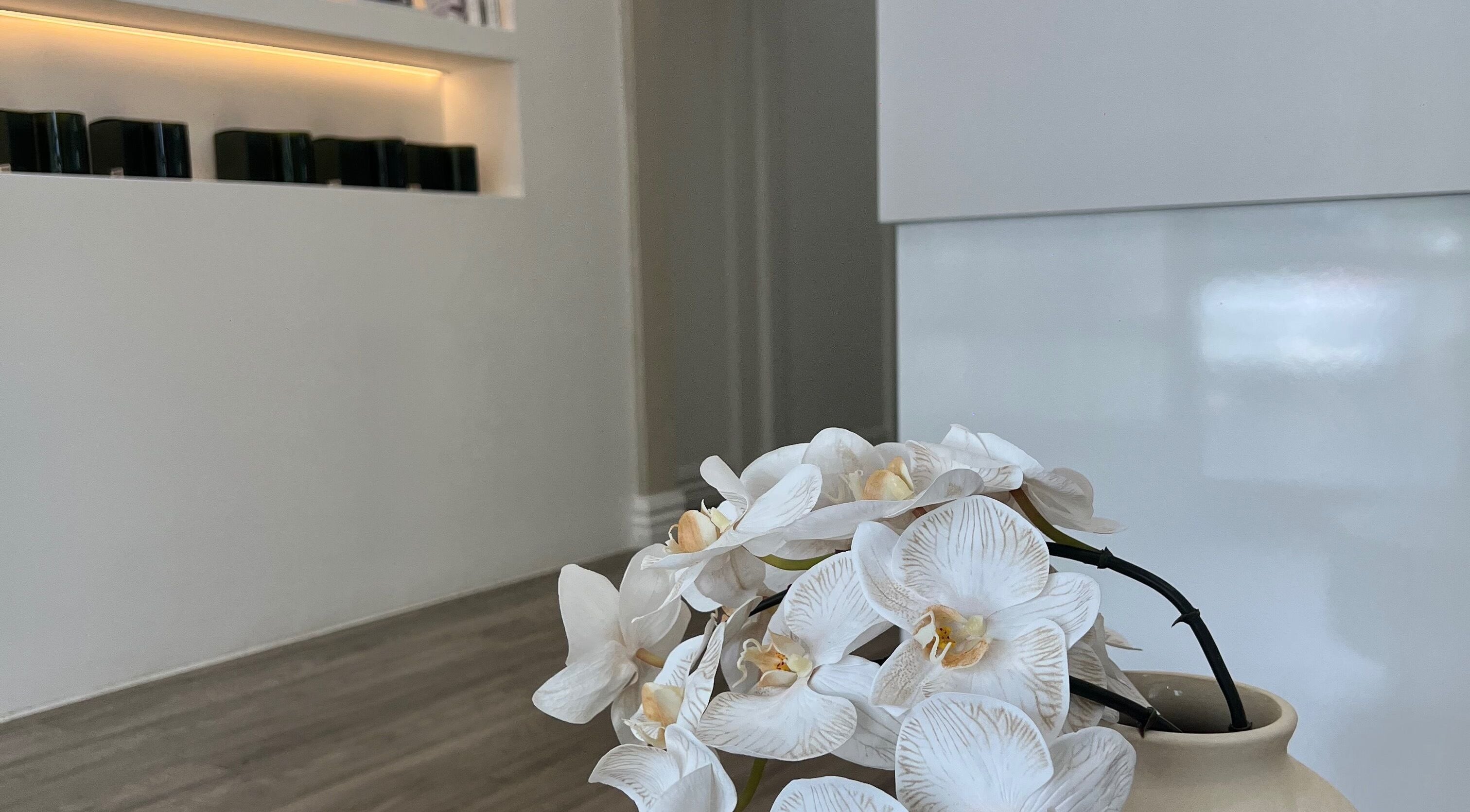 Elegant orchids at Serènity Aesthetics, Melbourne, Victoria, AU enhance the tranquil ambiance.