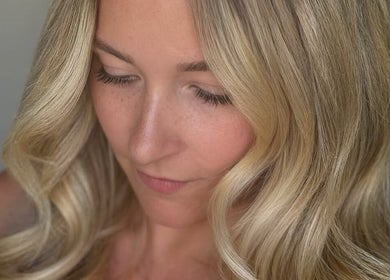 Blonde woman with elegant curls at Chicah Hair Ryde, Ryde, England, GB.