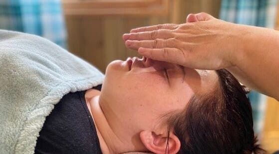Relaxing therapy session at Wyrd Thistle Therapies, Methil, Scotland, GB, featuring gentle hand techniques.