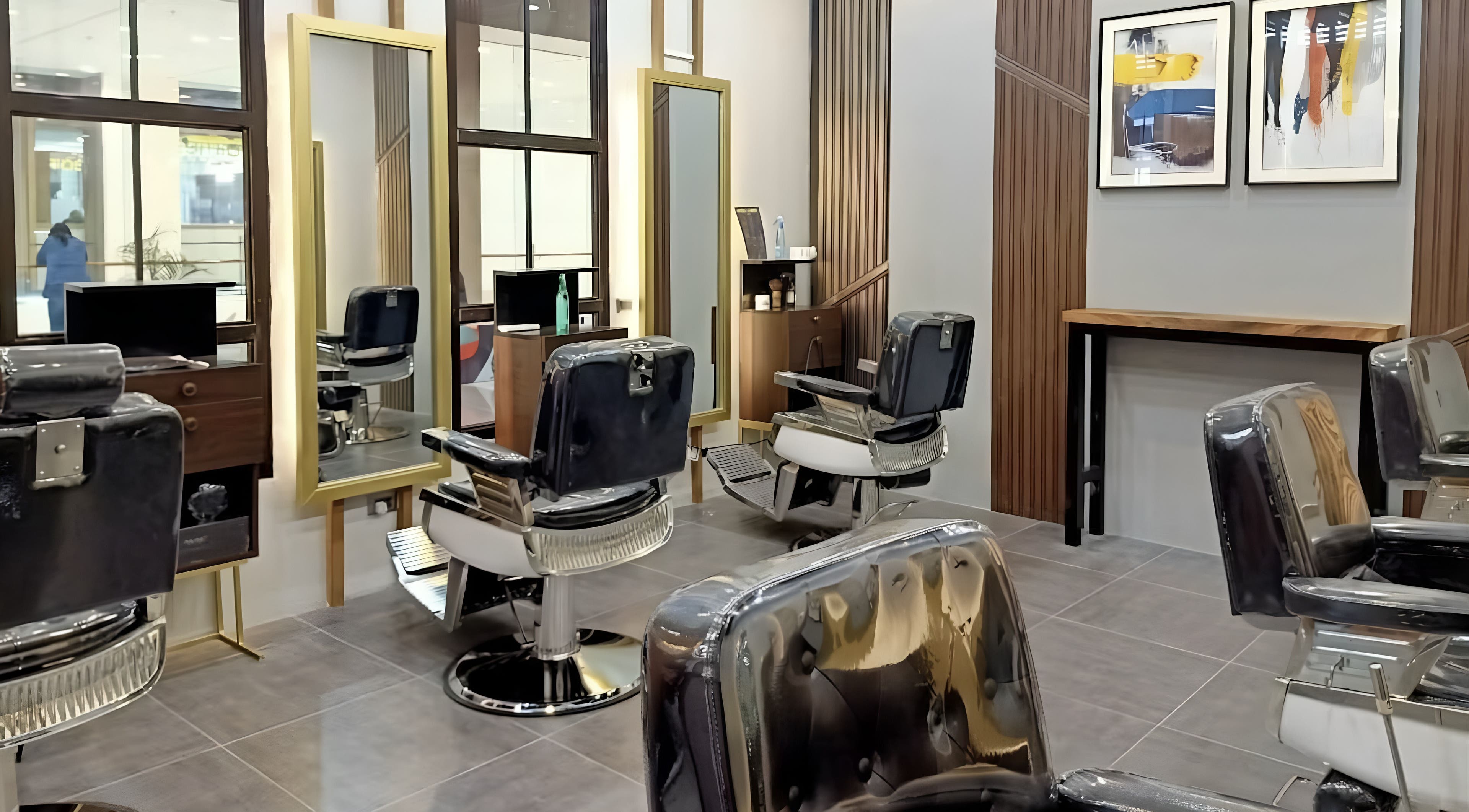 Modern hair salon at La Union - Robinsons Place Mall, San Fernando, Ilocos Region, PH, with sleek chairs and mirrors.