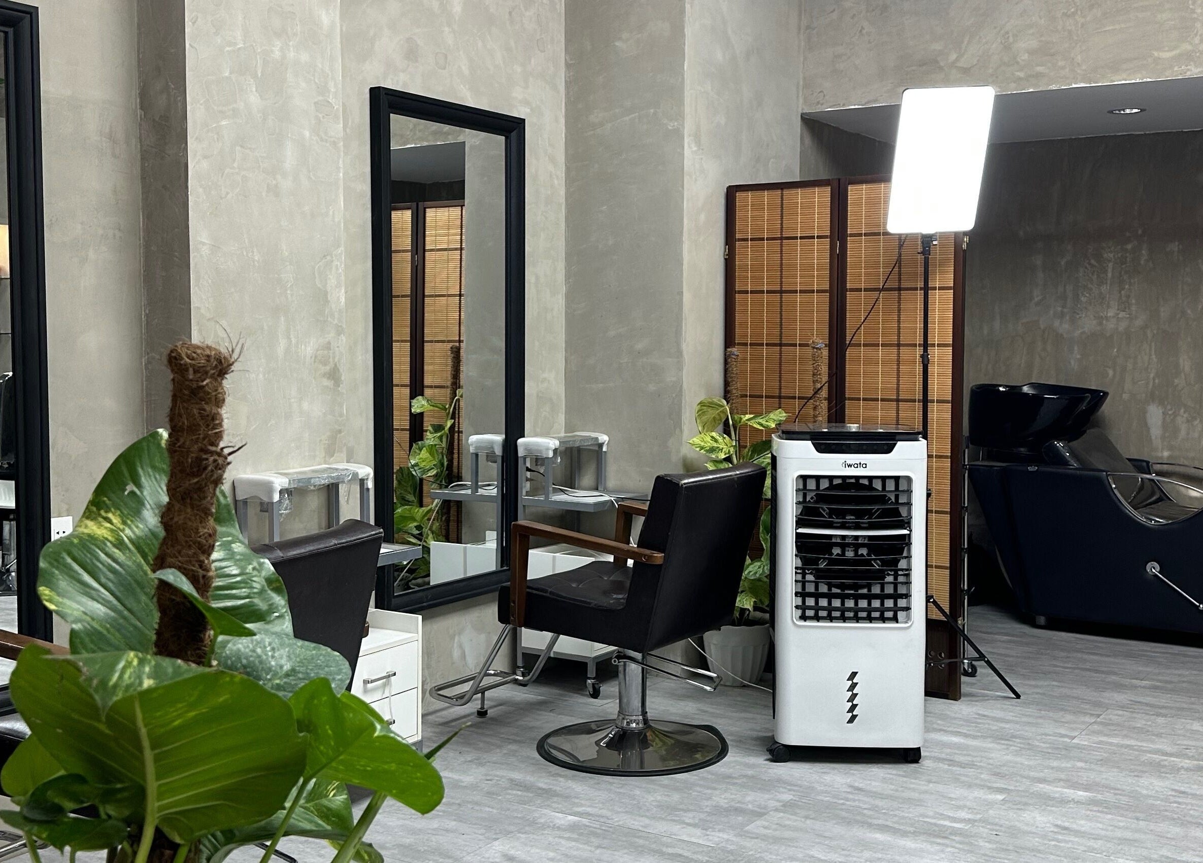 Modern salon interior at La Trinidad Branch, La Trinidad, Benguet, PH, featuring stylish chairs and mirrors.