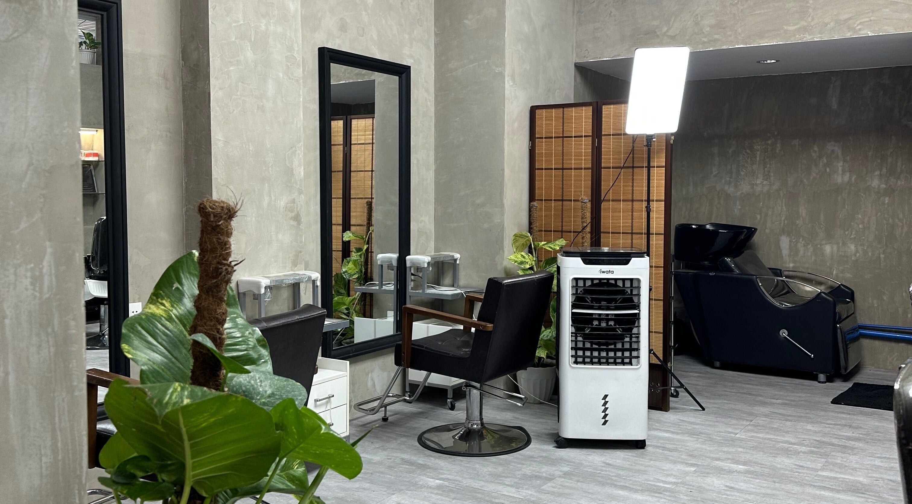 Modern salon interior at La Trinidad Branch, La Trinidad, Benguet, PH, featuring stylish chairs and mirrors.