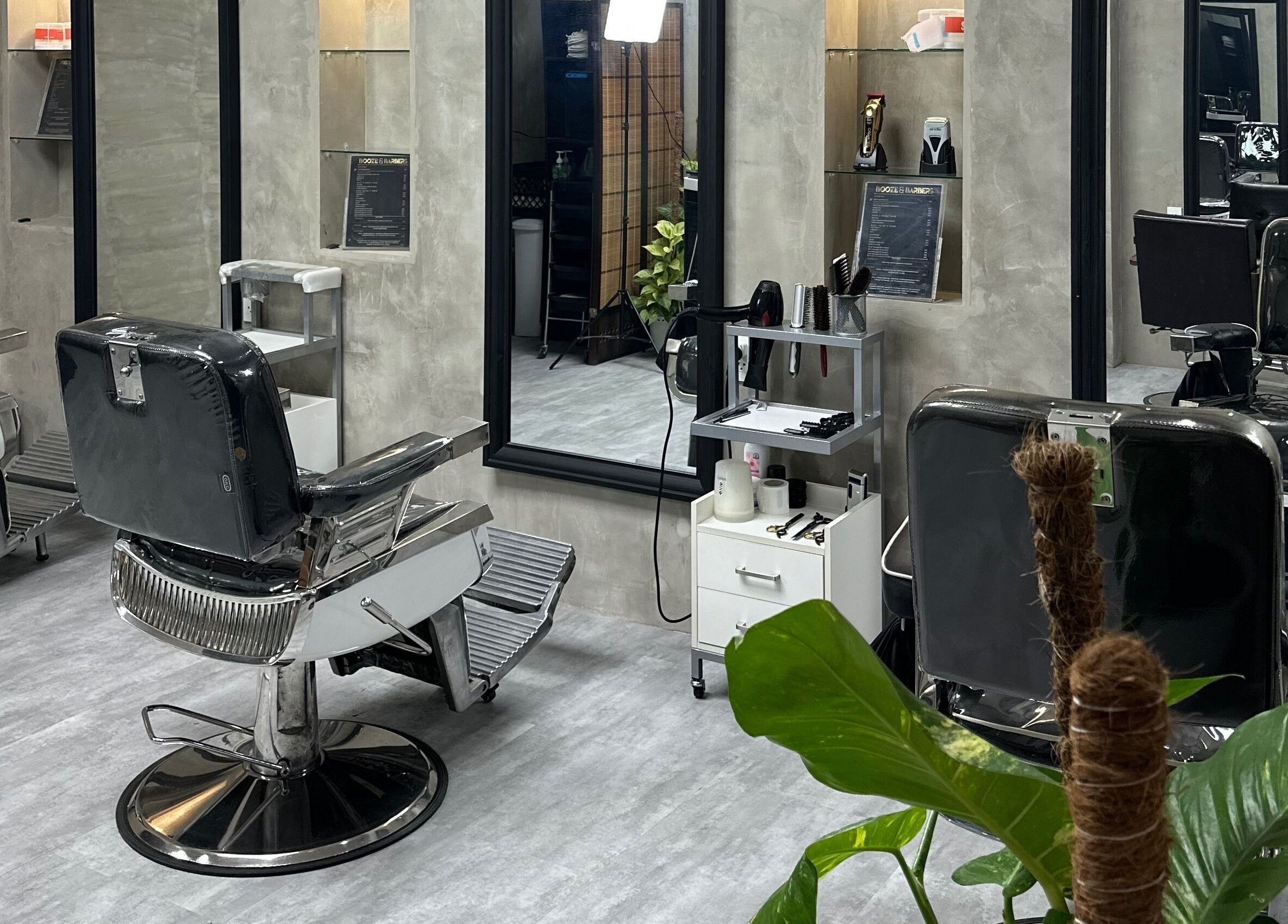 Stylish salon interior at La Trinidad Branch, La Trinidad, Benguet, PH with modern barber chairs and decor.