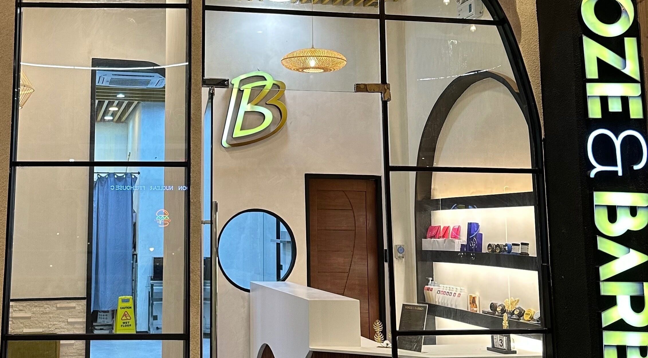 Stylish entrance of a beauty venue at SM City La Union, San Fernando City, PH with modern design.