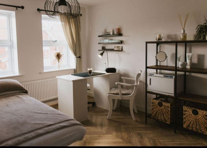 Tranquil treatment room at Beauty by Abbi, Grimsby, England, GB with elegant decor and soft lighting.