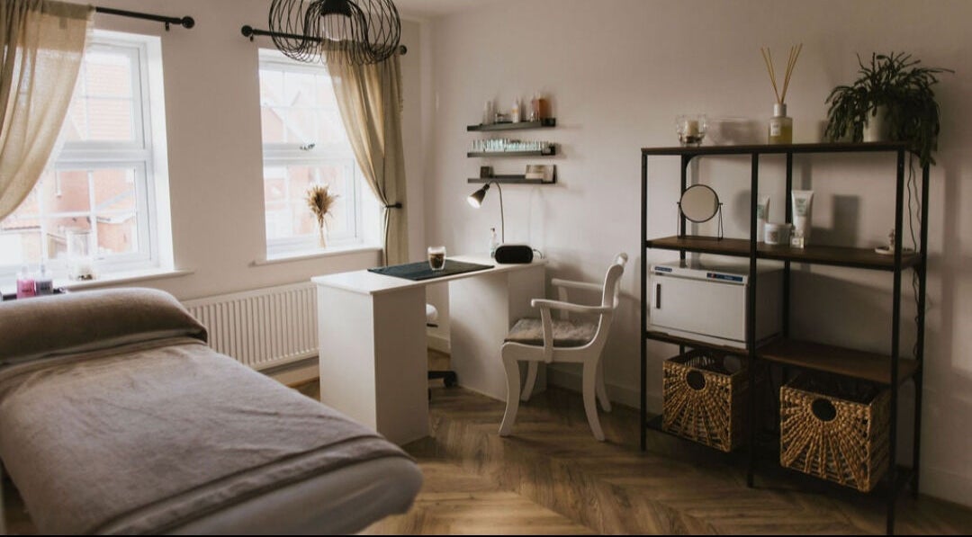 Tranquil treatment room at Beauty by Abbi, Grimsby, England, GB with elegant decor and soft lighting.
