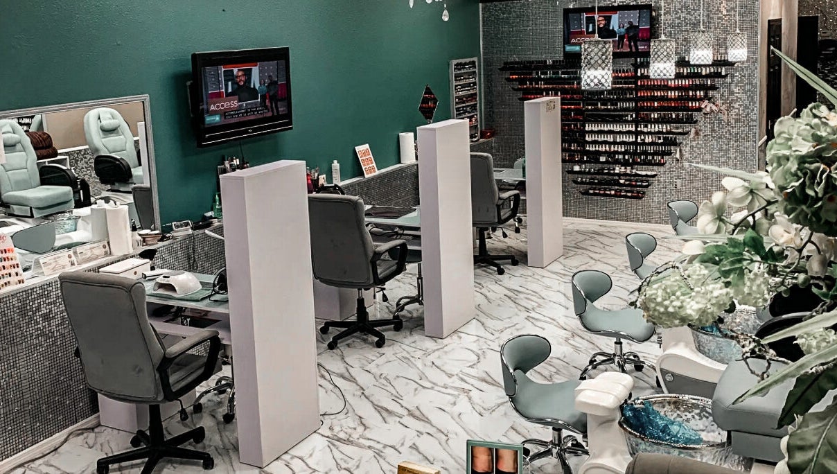 Interior of Hollywood Nails, Englewood, Florida, US showcasing manicure stations and modern design.
