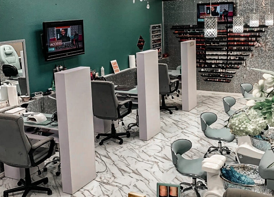 Interior of Hollywood Nails, Englewood, Florida, US showcasing manicure stations and modern design.