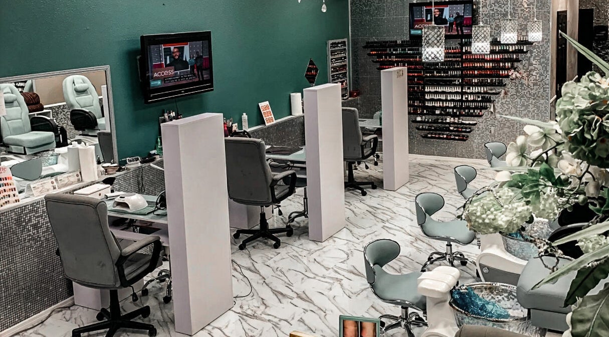 Interior of Hollywood Nails, Englewood, Florida, US showcasing manicure stations and modern design.
