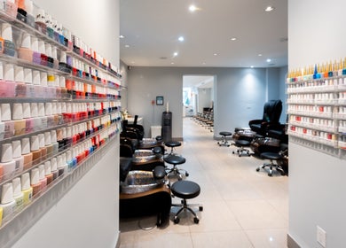 Colorful nail polish display at Star Nails & Spa, Toronto, Ontario, CA, showcasing pedicure stations.