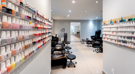 Colorful nail polish display at Star Nails & Spa, Toronto, Ontario, CA, showcasing pedicure stations.