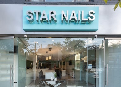 Front view of Star Nails & Spa in Toronto, Ontario, CA, showcasing a modern glass entrance and elegant ambiance.