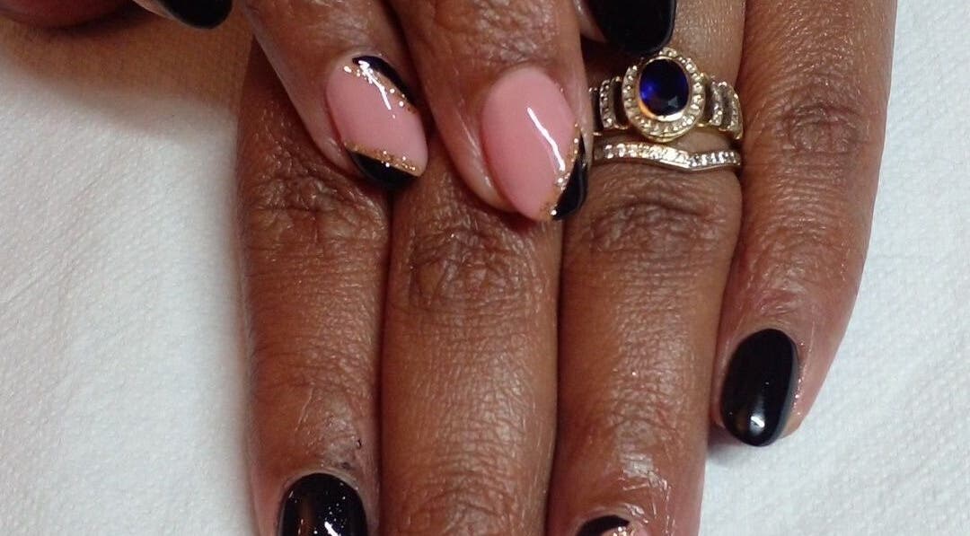 Stylish manicure at 52 Hof Street Tableview, Cape Town, Western Cape, ZA, showcasing black and nude design.