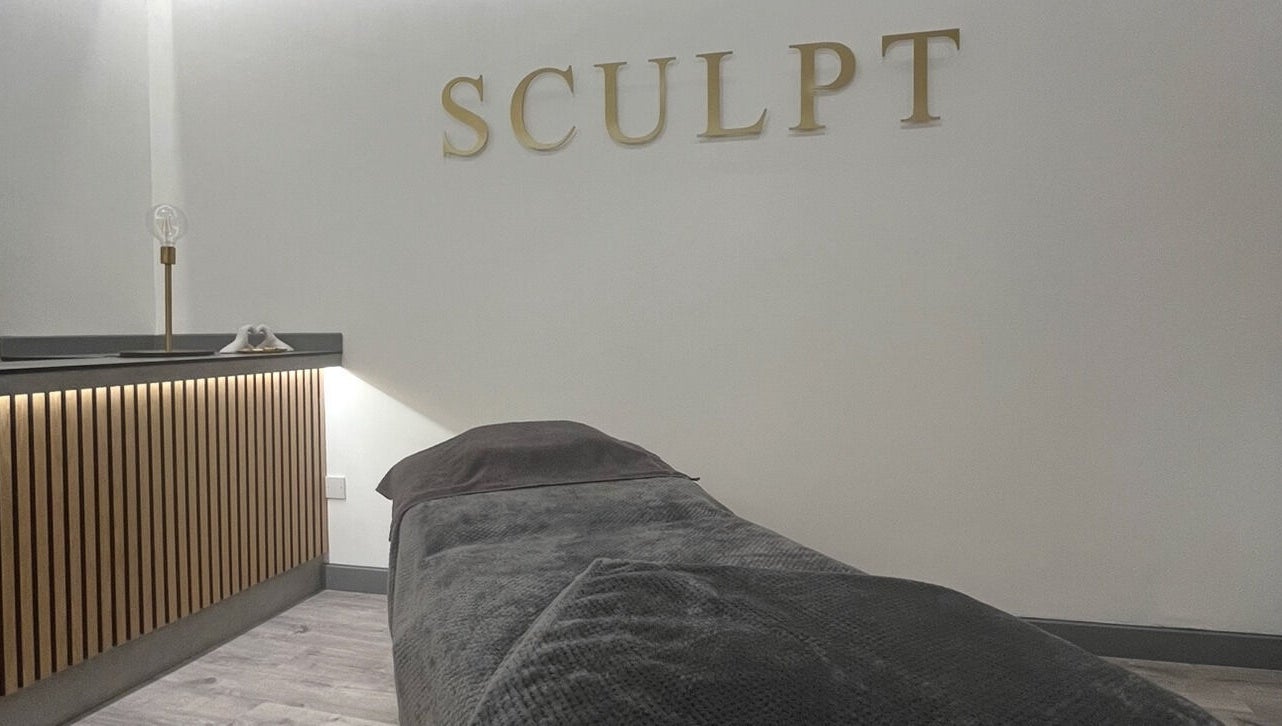 Relaxing therapy room at Sculpt at Cleckheaton, Cleckheaton, England, GB with a cozy massage bed.
