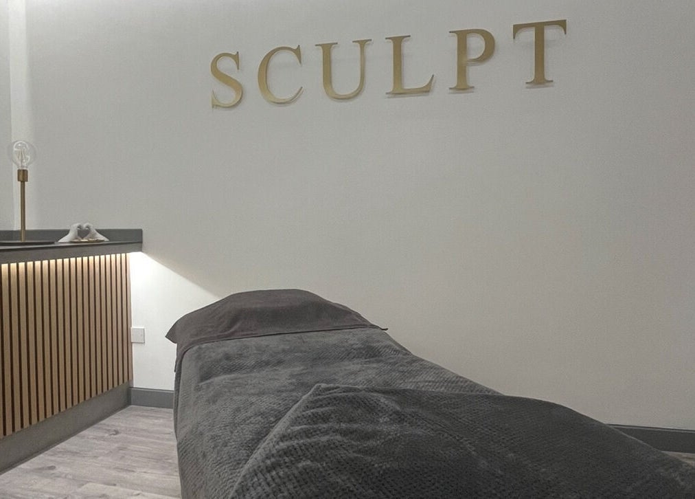 Relaxing therapy room at Sculpt at Cleckheaton, Cleckheaton, England, GB with a cozy massage bed.