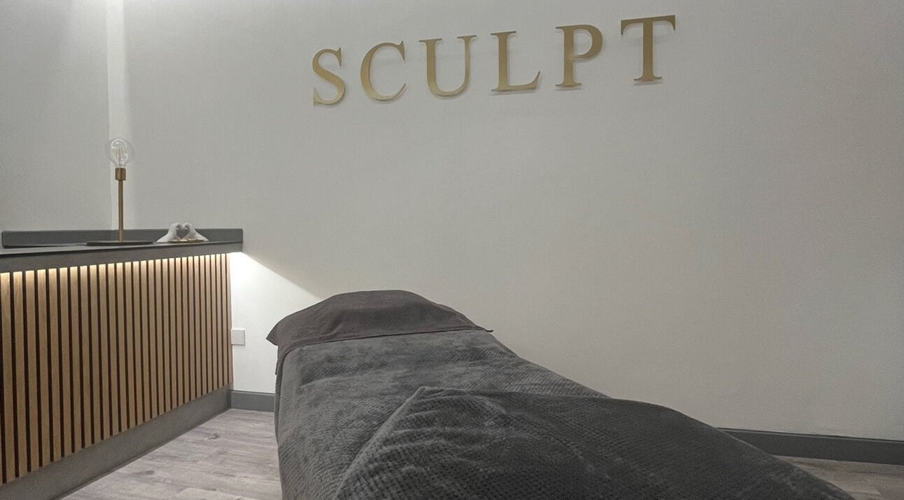Relaxing therapy room at Sculpt at Cleckheaton, Cleckheaton, England, GB with a cozy massage bed.
