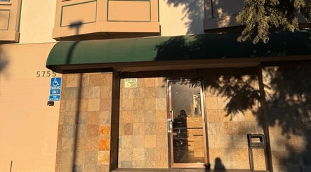 Front entrance of MMBW Industry in Ventura, California, US, featuring a welcoming doorway and accessible parking.