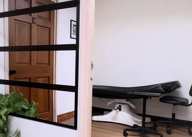 Calm treatment room at MMBW Industry in Ventura, California, US, featuring a chair and plants.