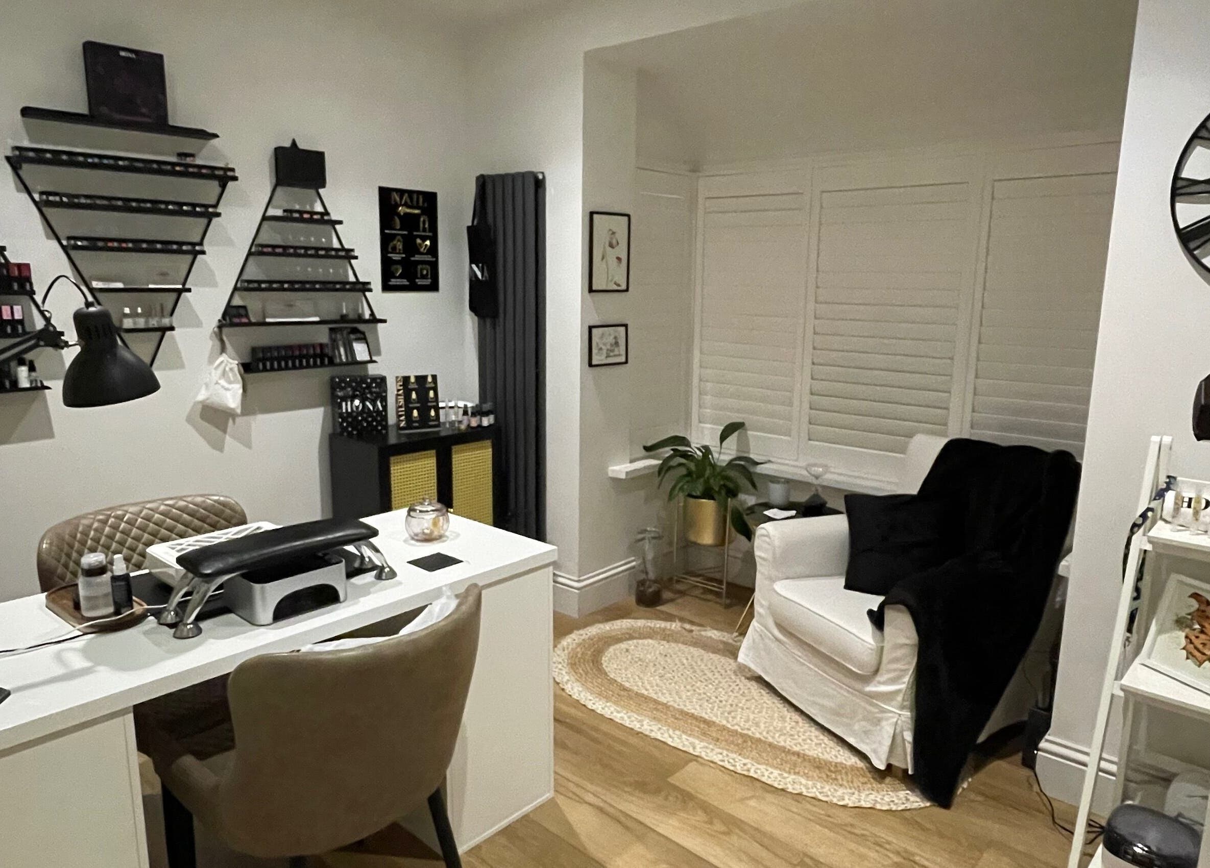 Elegant nail salon interior at Nails by Robyn Slade, Brighton And Hove, England, GB, with chic decor and nail polish display.