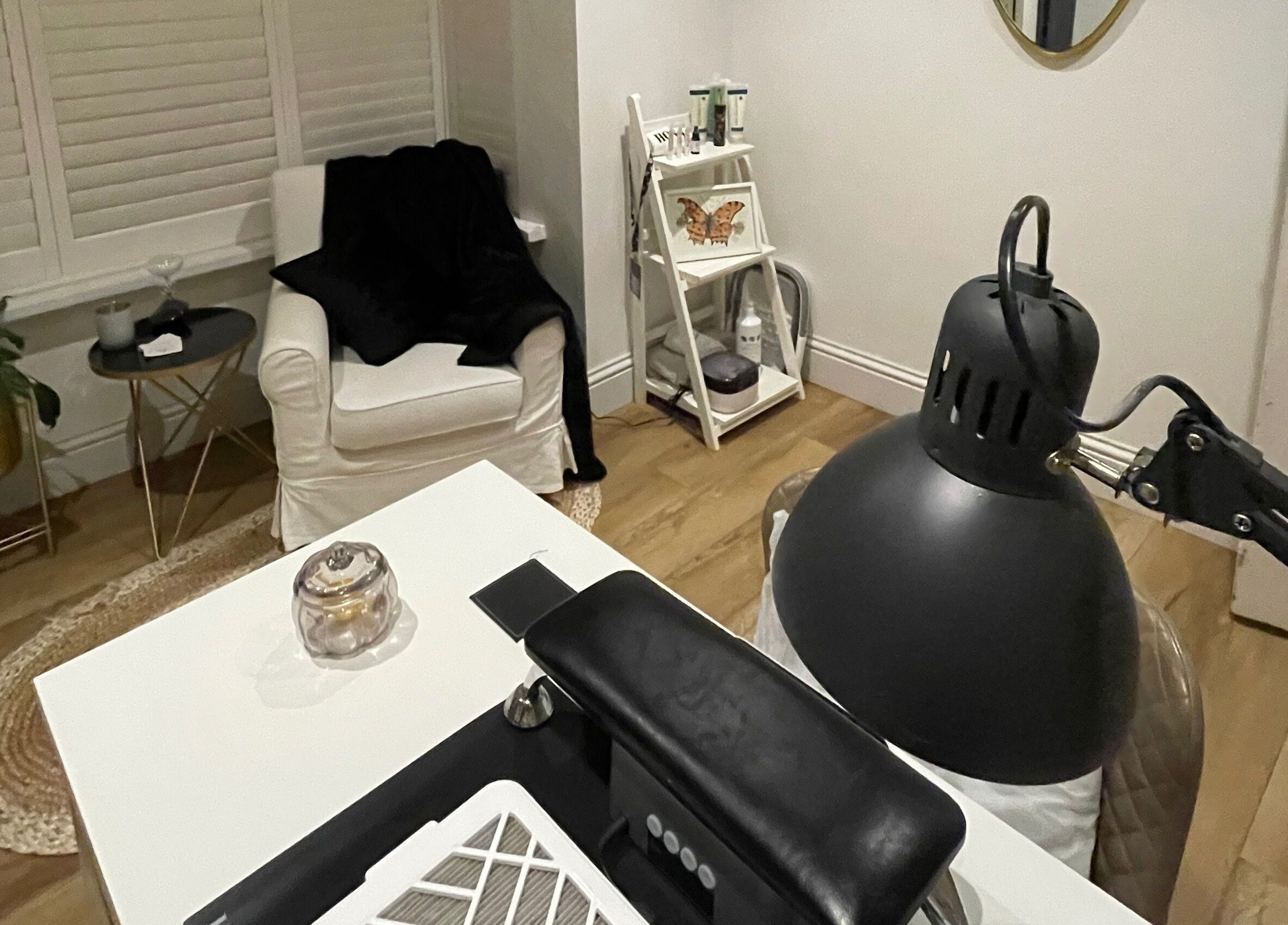 A cozy nail salon corner with a white armchair at Nails by Robyn Slade, Brighton And Hove, England, GB.