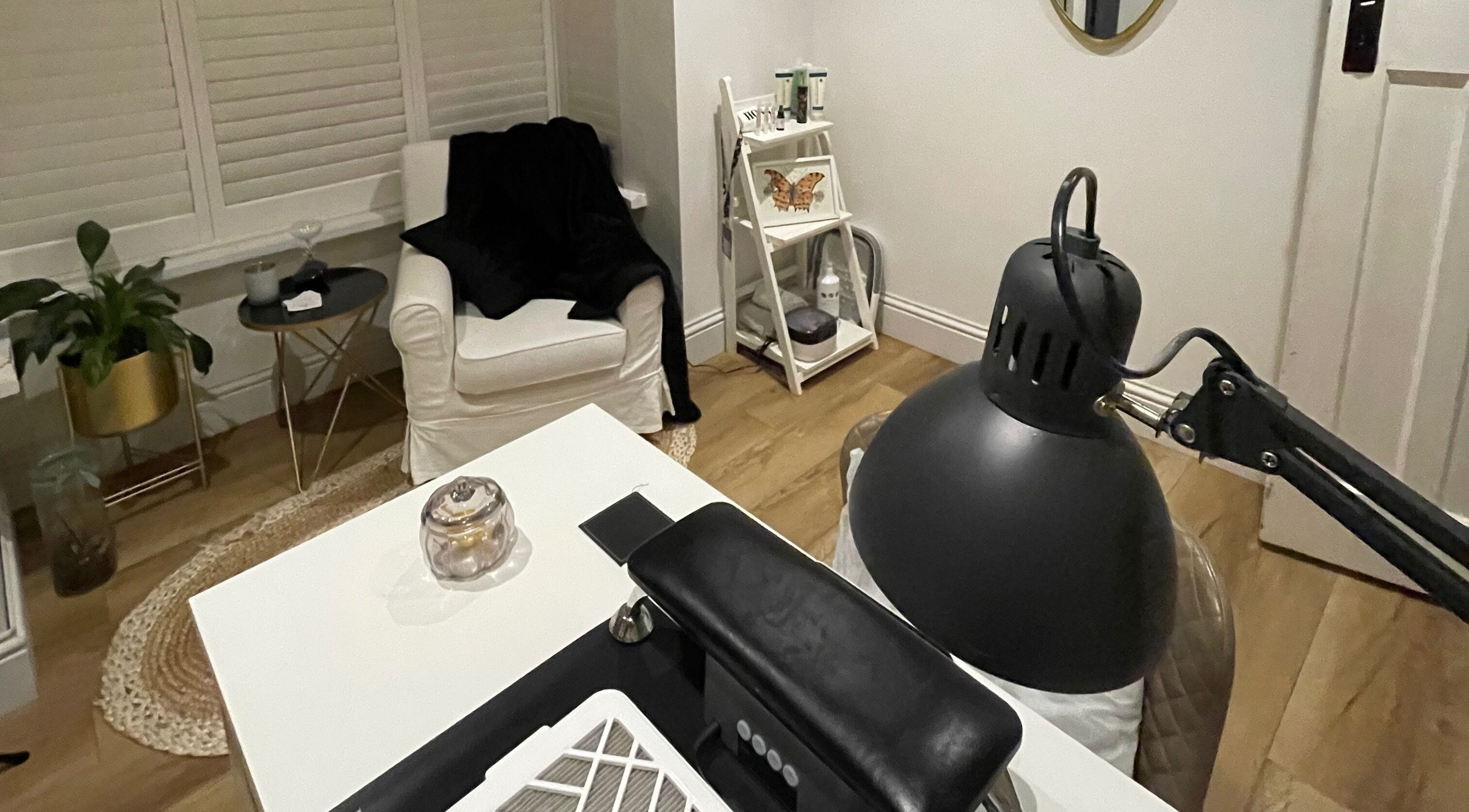 A cozy nail salon corner with a white armchair at Nails by Robyn Slade, Brighton And Hove, England, GB.