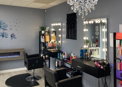 Stylish interior of Ella Wellness Studio in Hamilton, Ontario, CA with salon chairs, mirrors, and product shelves.