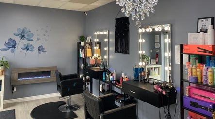 Stylish interior of Ella Wellness Studio in Hamilton, Ontario, CA with salon chairs, mirrors, and product shelves.