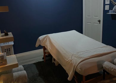 Cozy massage room with dim lighting at Ella Wellness Studio, Hamilton, Ontario, CA.