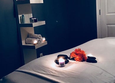 Tranquil massage room with candles at Ella Wellness Studio, Hamilton, Ontario, CA.