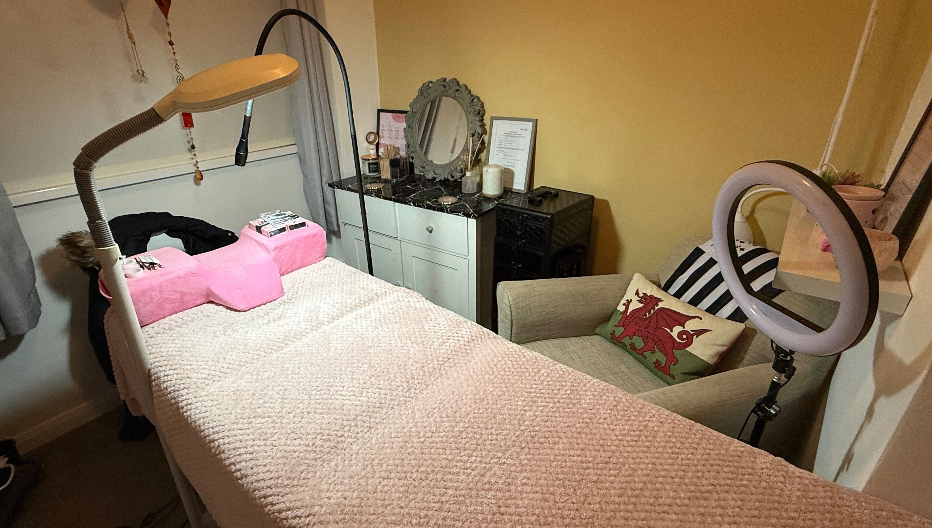 Cozy treatment room at Leeswood, Leeswood, Wales, GB, featuring a plush bed and elegant decor.