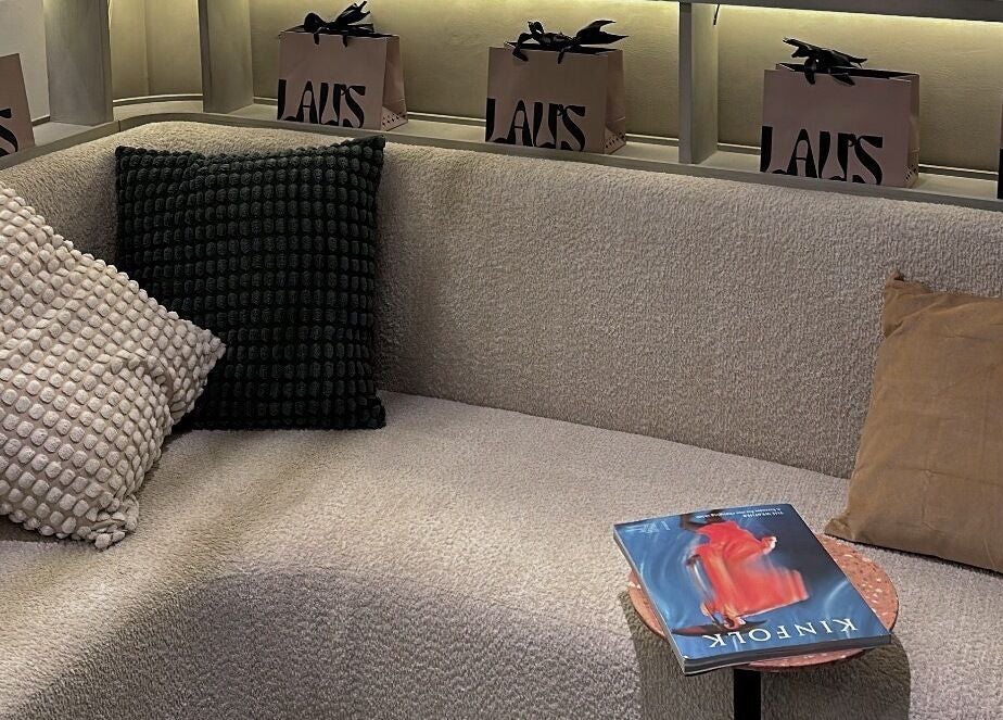 Comfortable lounge with plush pillows at LAU’S BEAUTY, featuring gift bags, Bali, Bali, ID.