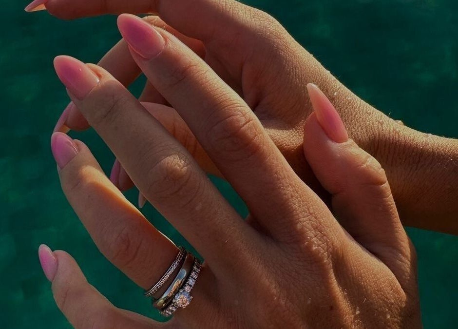 Elegant pink manicure at LAU’S BEAUTY, Bali, Bali, ID showcasing stylish rings and polished nails.