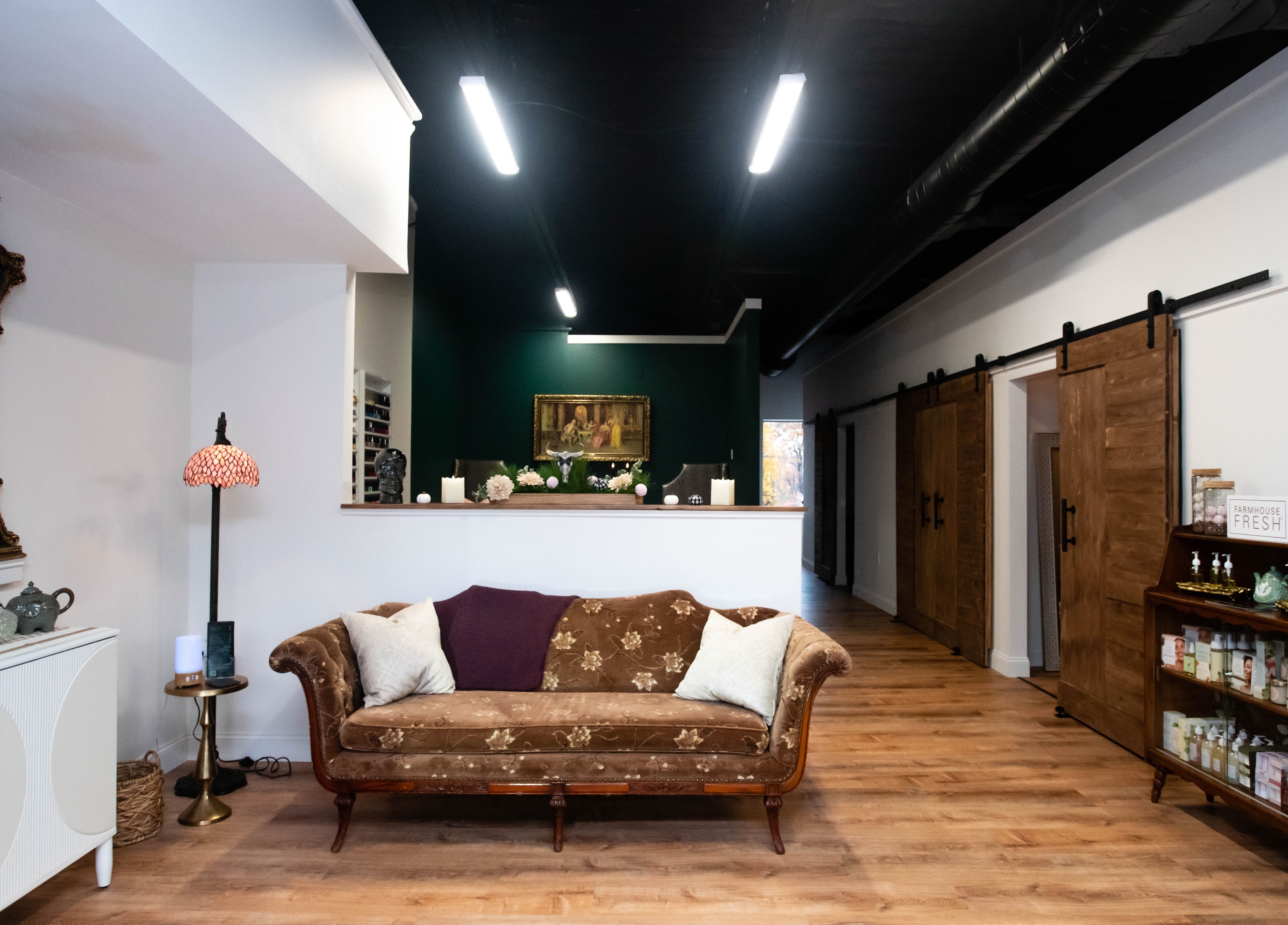 Case of Elegance Wellness Spa lobby in Archbald, Pennsylvania, US features a vintage sofa and warm decor.