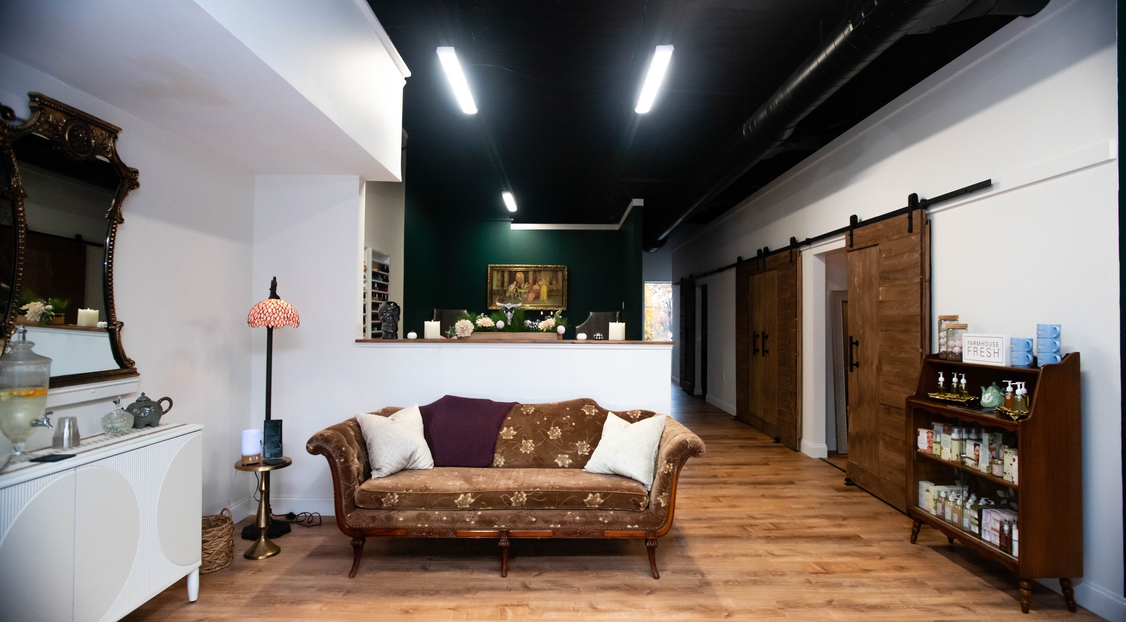 Case of Elegance Wellness Spa lobby in Archbald, Pennsylvania, US features a vintage sofa and warm decor.
