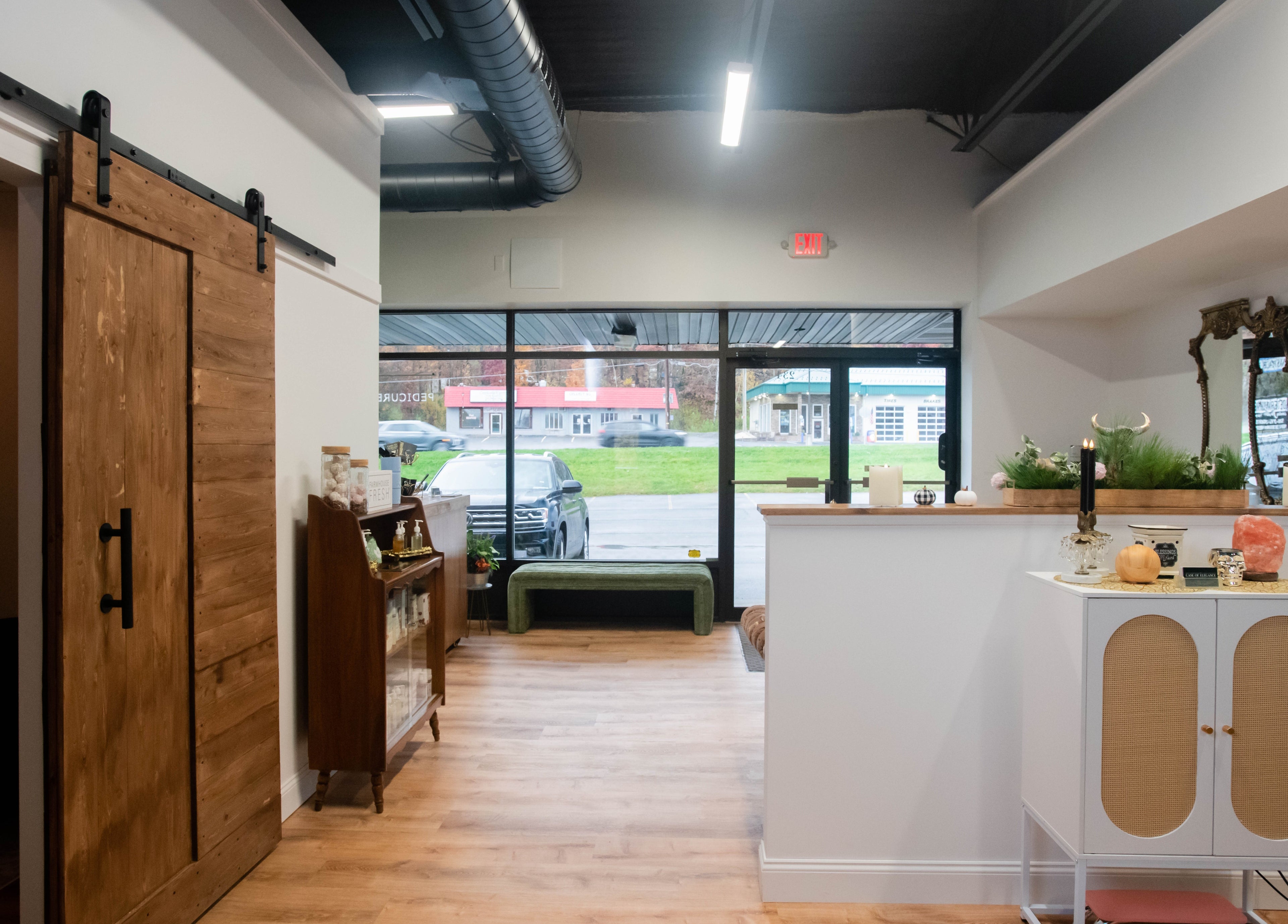 Reception area of Case of Elegance Wellness Spa, Archbald, Pennsylvania, US, showcasing rustic decor and wooden elements.