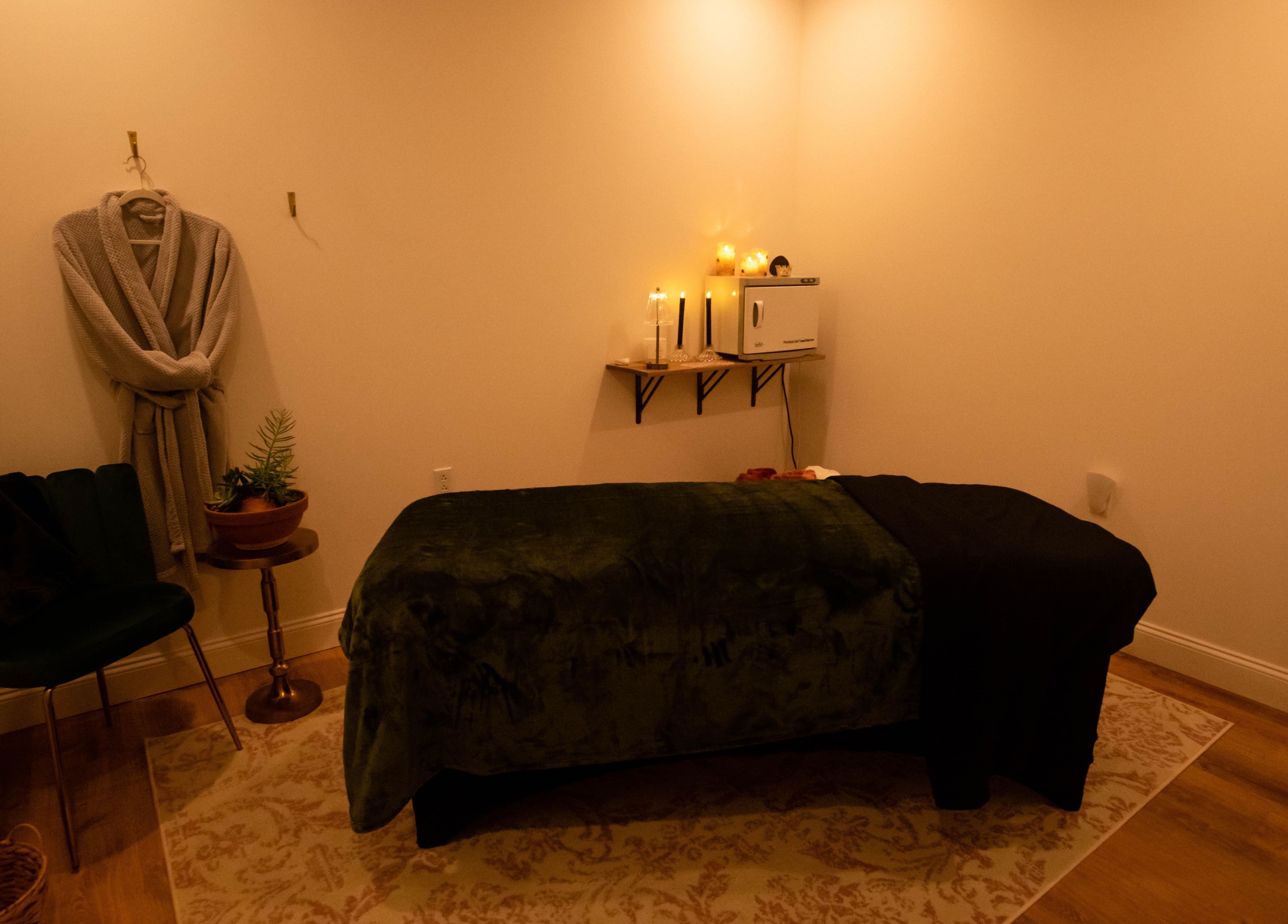 Relaxing massage room at Case of Elegance Wellness Spa, Archbald, Pennsylvania, US. Cozy ambiance with candles.