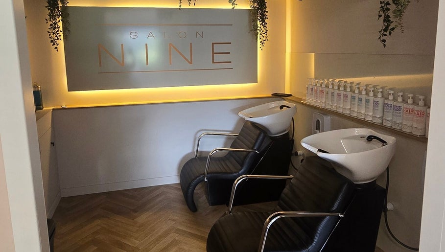 Luxurious shampoo area at Salon Nine, Glenrothes, Scotland, GB with sleek chairs and product display.
