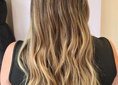 Styled wavy blonde hair at Salon Nine in Glenrothes, Scotland, GB showcasing professional hair services.