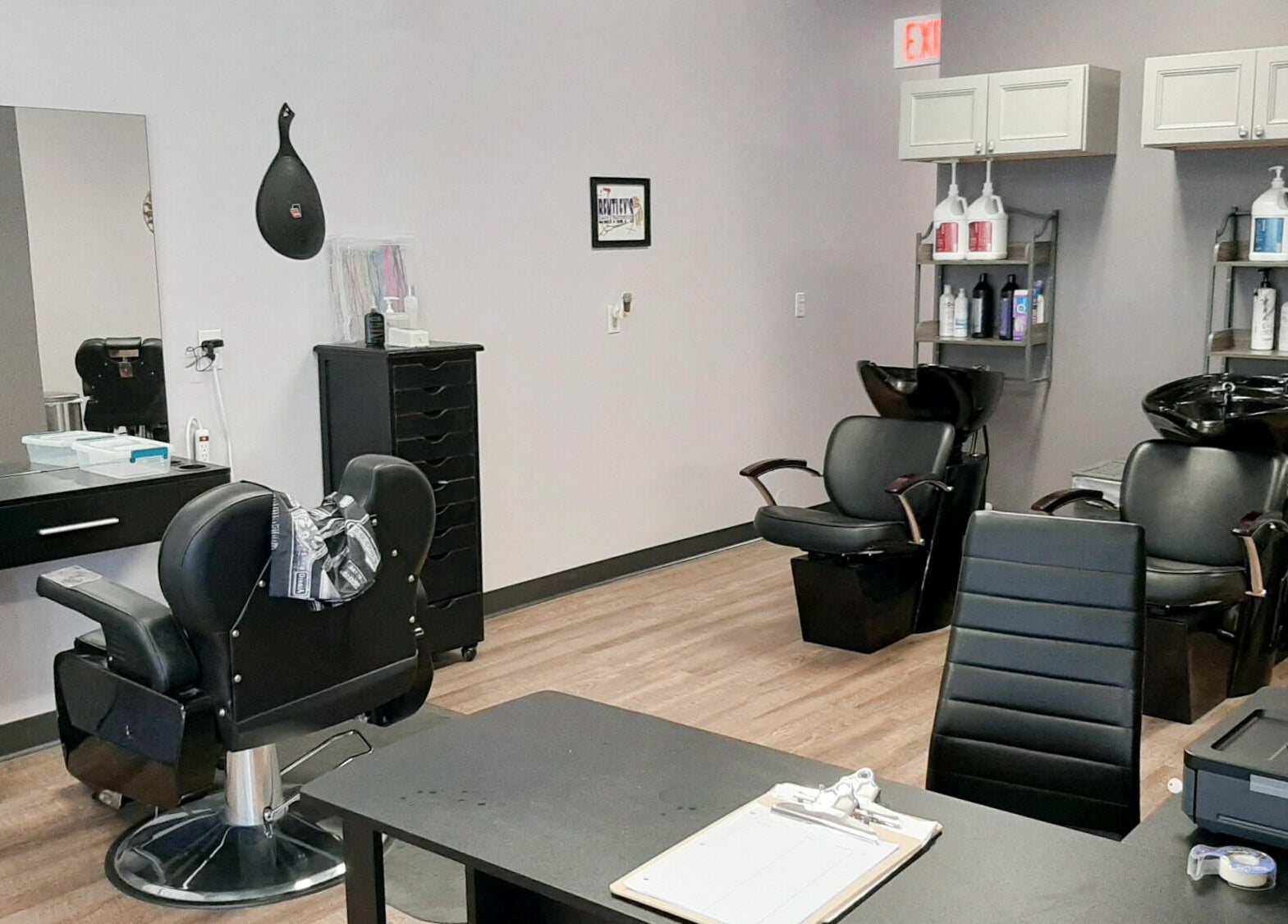 Bentley's Salon and Barbershop interior with modern chairs and washing stations in Schuylerville, New York, US.