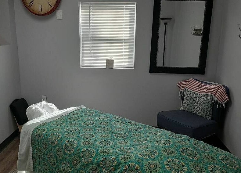 Relaxing massage room at Bentley's Salon and Barbershop, Schuylerville, New York, US with inviting decor.