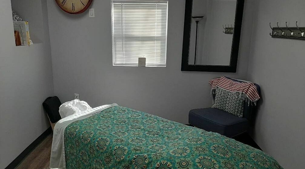 Relaxing massage room at Bentley's Salon and Barbershop, Schuylerville, New York, US with inviting decor.