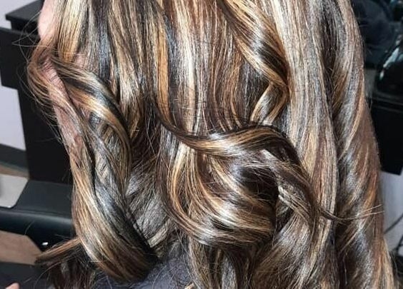 Luxurious wavy highlights at Bentley's Salon and Barbershop, Schuylerville, New York, US.