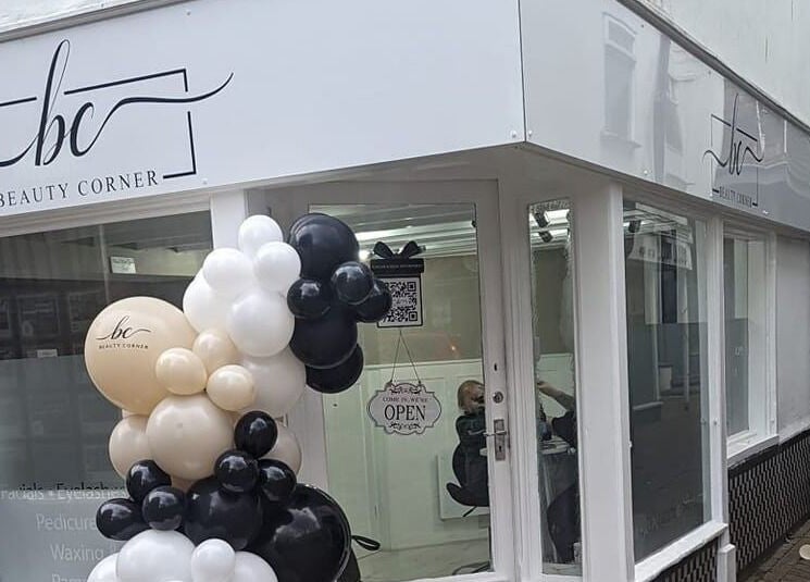 Beauty Corner storefront in Ashford, England, GB with elegant balloon decor.