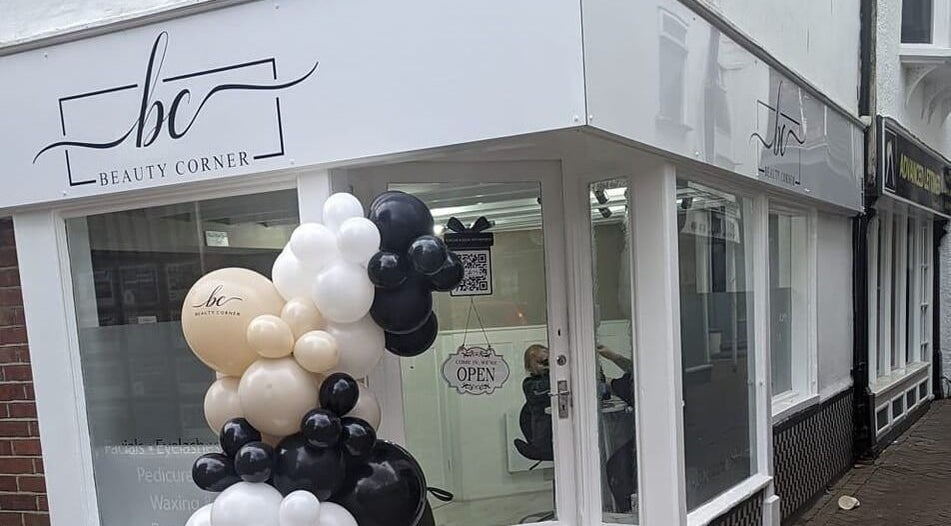 Beauty Corner storefront in Ashford, England, GB with elegant balloon decor.